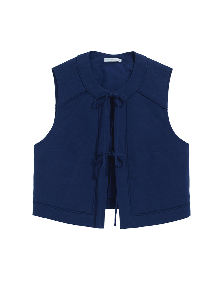 The front of the Ella Vest in the Midnight color. Features two ties in the front. 