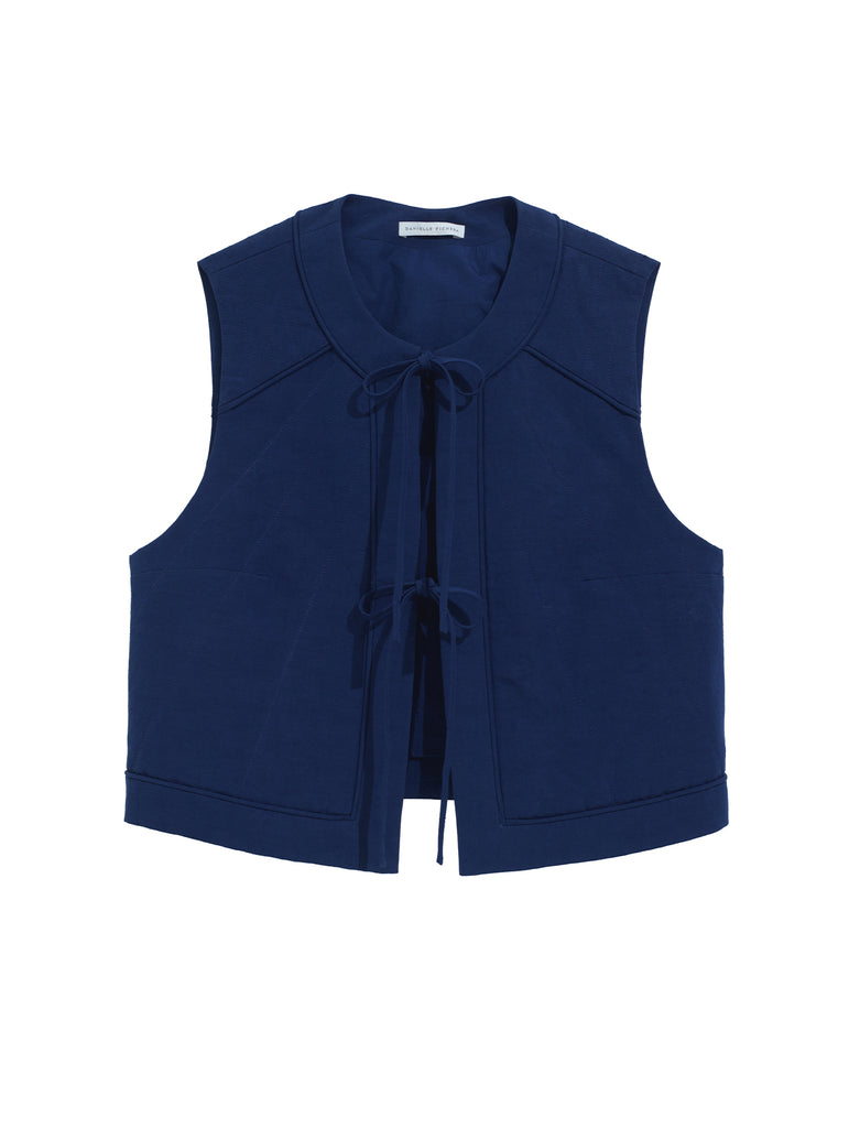 The front of the Ella Vest in the Midnight color. Features two ties in the front.