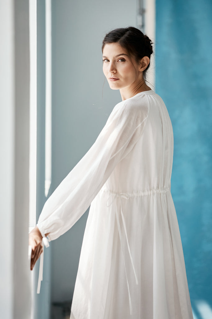 Model wearing Mia Caftan Dress made with White Linen and Cotton