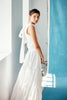 Model wearing Emma Gilet in white. 
