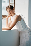 Model wearing Emma Gilet in white. 